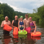 family swimming in the river wye